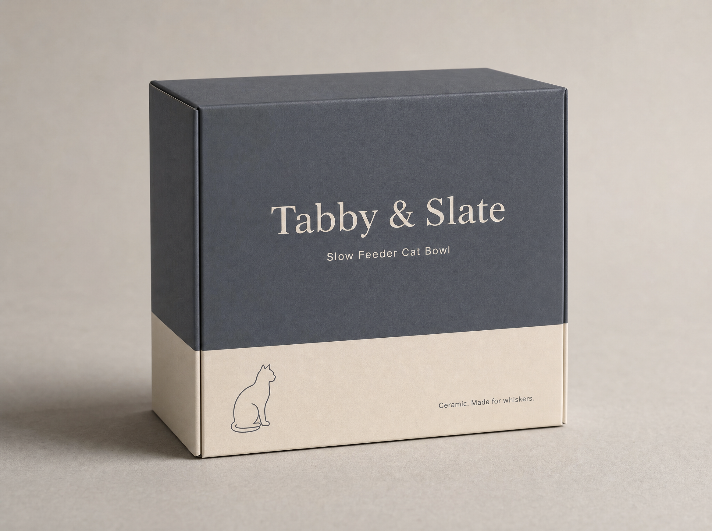 Tabby & Slate retail packaging box — slate gray top with cream foot band, wordmark and sitting-cat silhouette