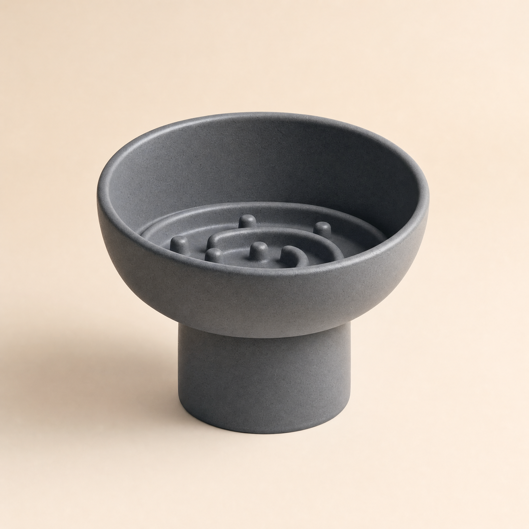 Tabby & Slate ceramic slow-feeder bowl in slate gray, three-quarter studio view on cream